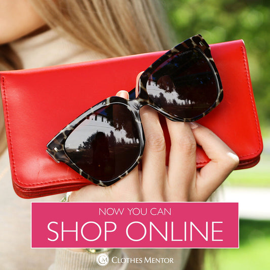 Sunglasses and Wallet in a Woman's hand